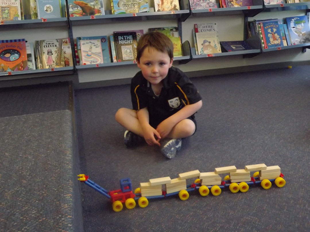 Patrick Harrison With His Creation In Library